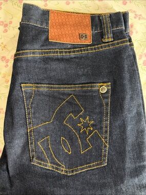 DC Men’s Dark Blue Jeans with Yellow Stitching and Brown Patch